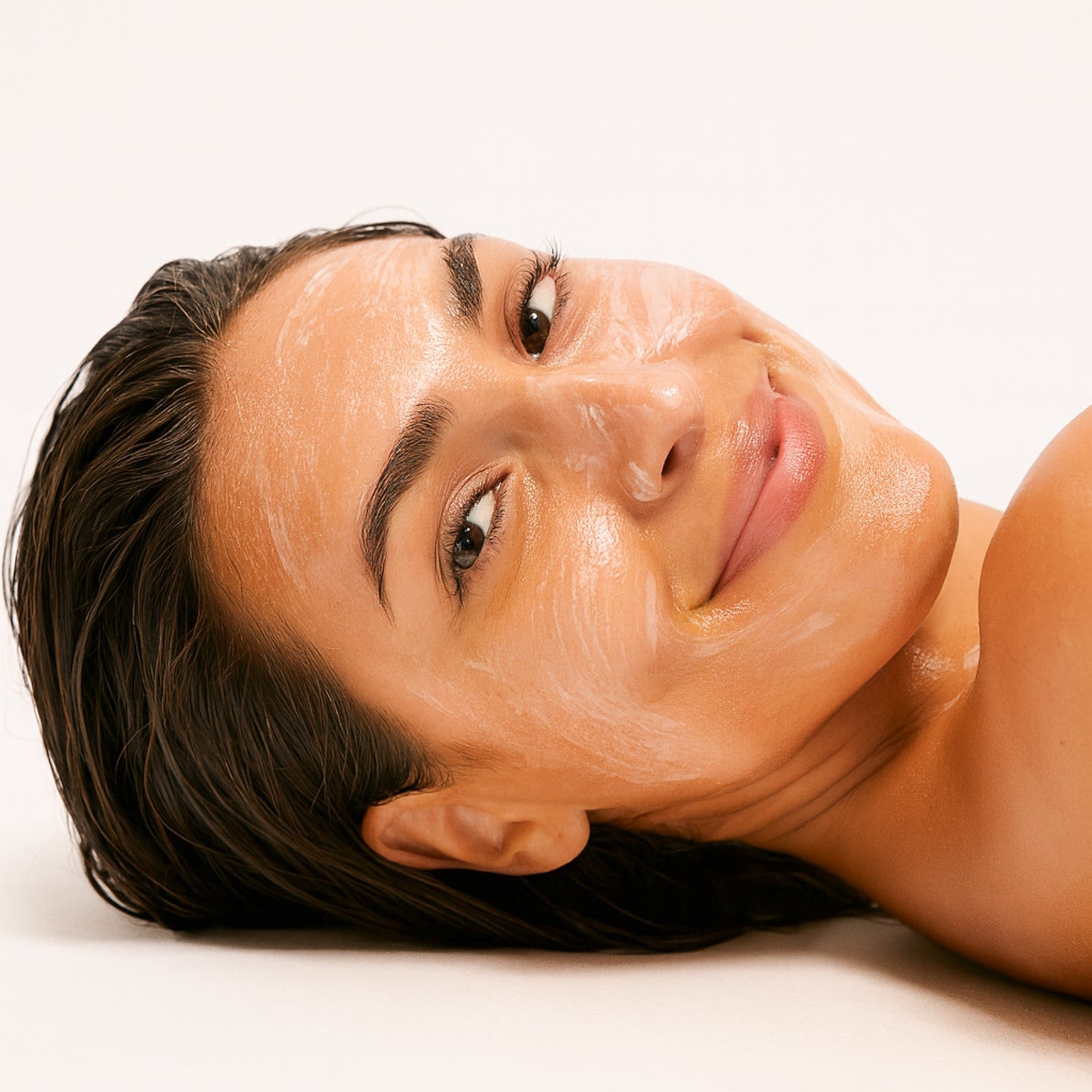 Person with a facial mask on a white background